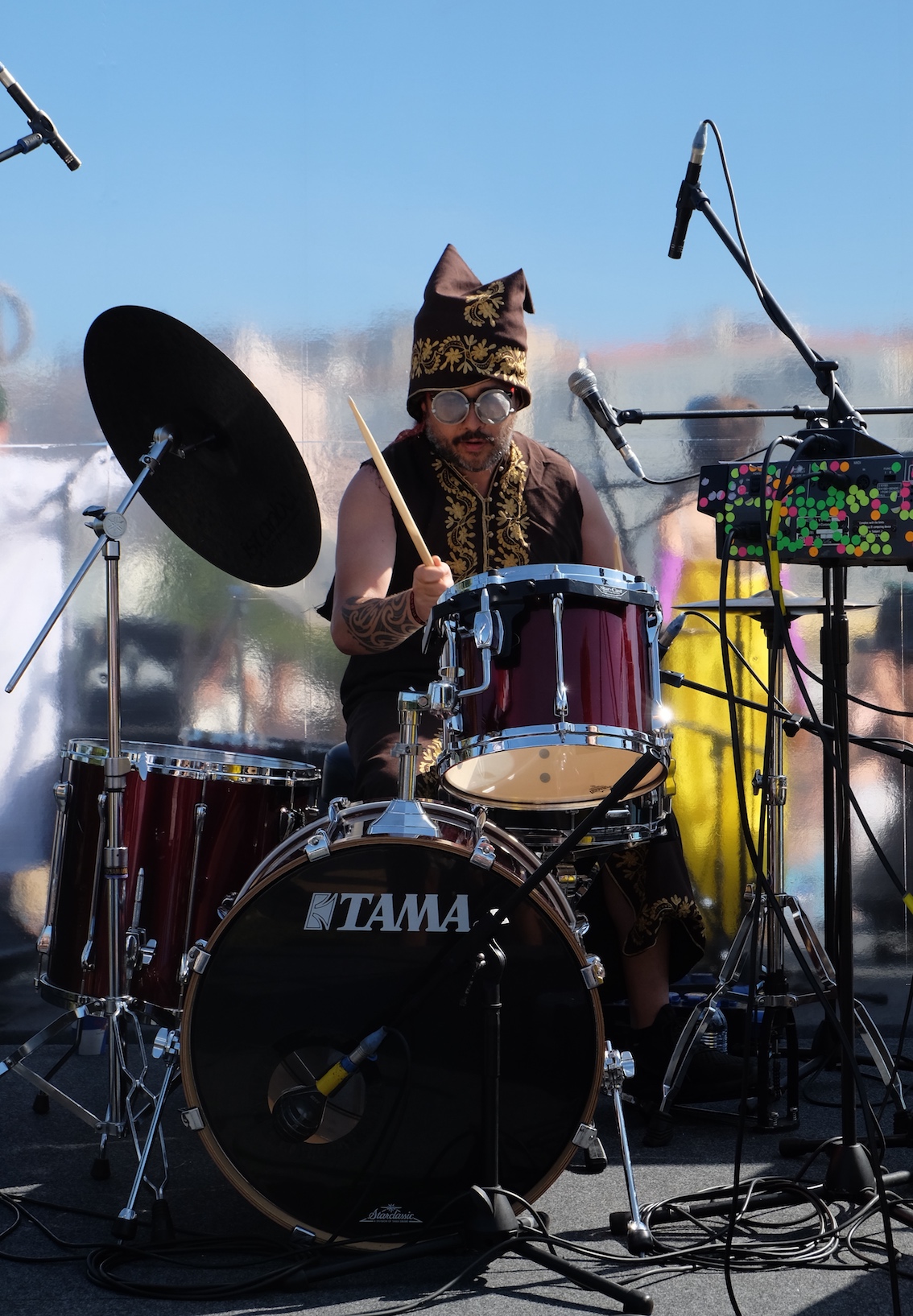 A photo of Riki Pirihi playing drums in Portugal for Orchestra of Spheres