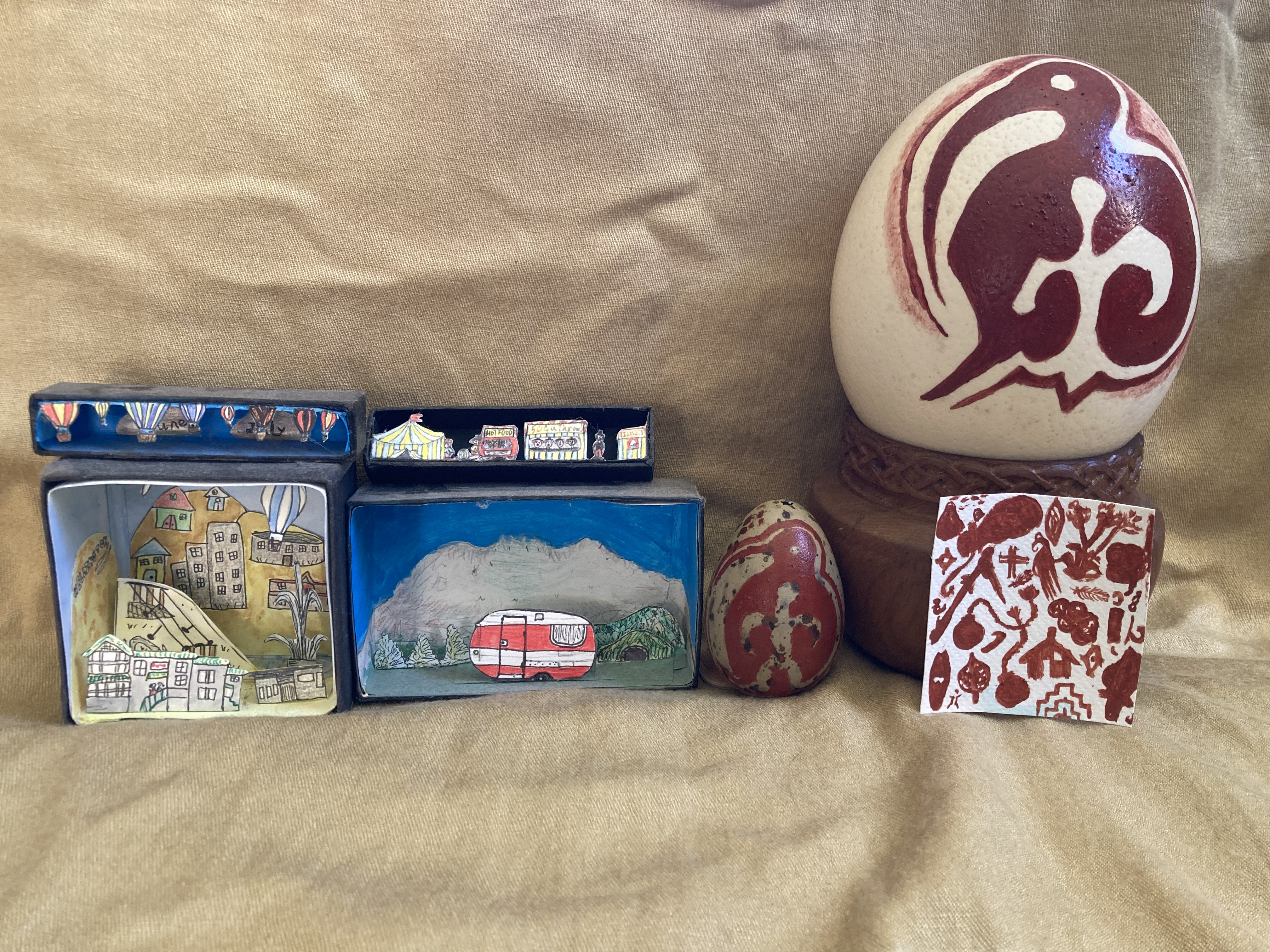 Diaroamas made from cardboard and paint - there are two large painted eggs also