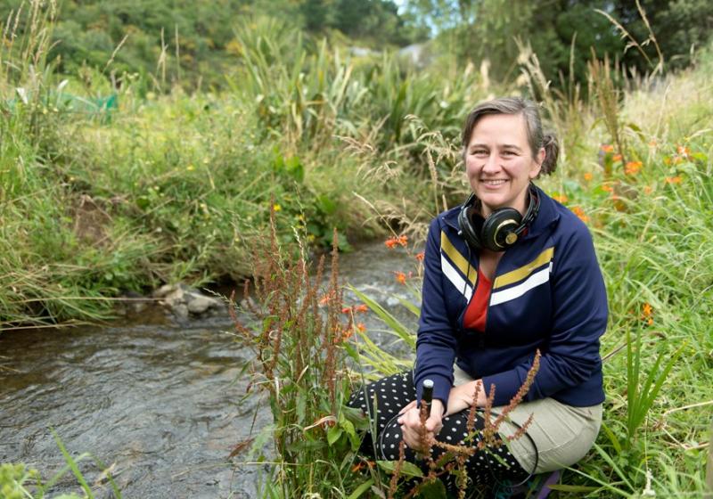 Kedron Parker beside a stream.