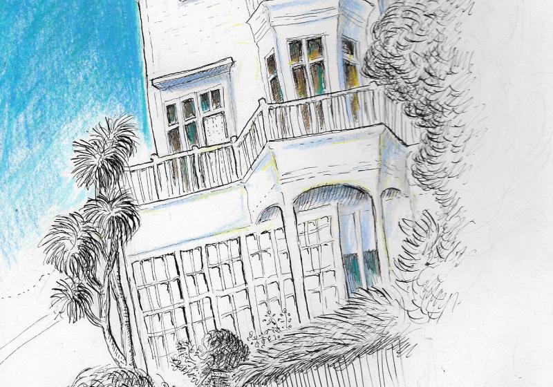 A tall, white, wooden house