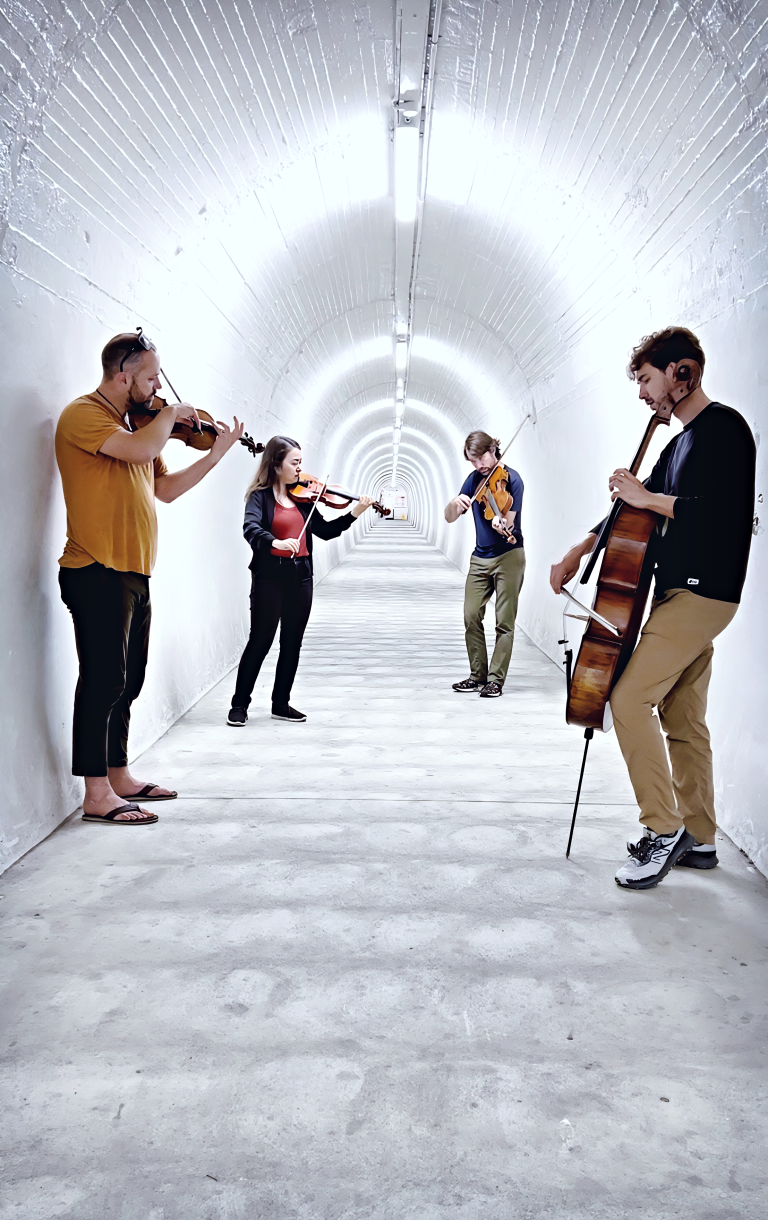 4 Composers in a tunnel with bright white lights