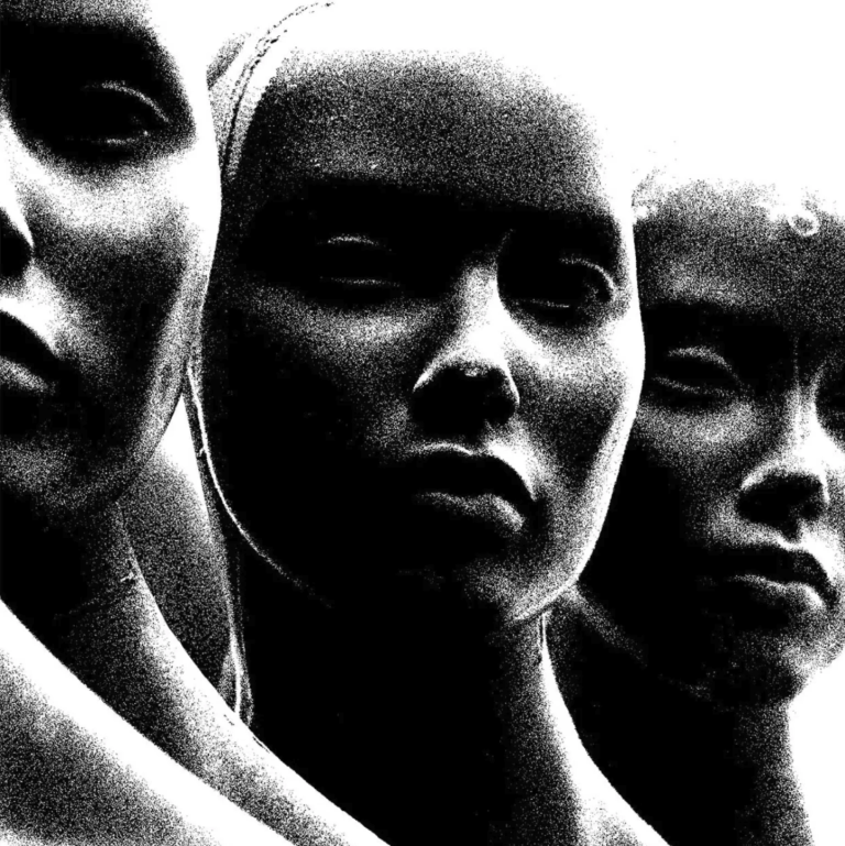 3 ominous black and white heads layered next to each other